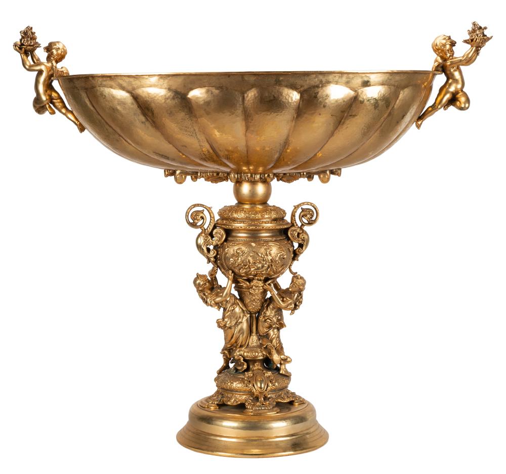 Appraisal: MONUMENTAL GILT-METAL BOWLthe oval bowl on a relief-decorated urn-form support