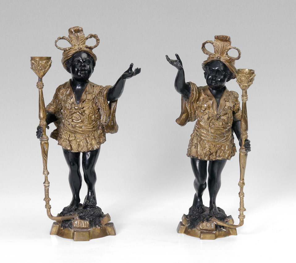 Appraisal: DECORATIVE PAIR OF BRONZE BLACKAMOOR CANDLESTICKS Contemporary casting each holds