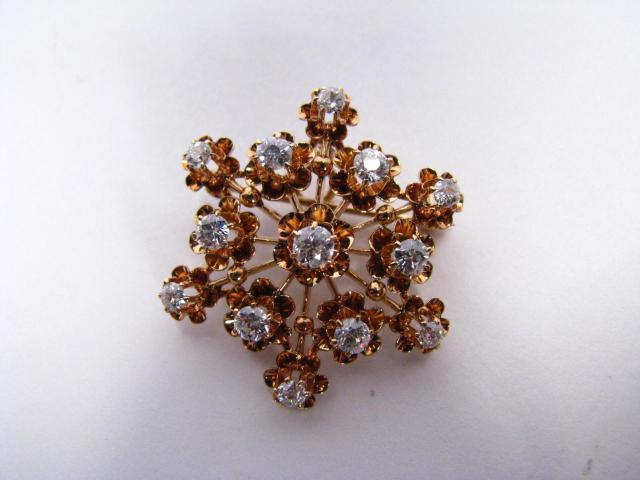 Appraisal: k yellow gold star spray-motif pin set with diamonds