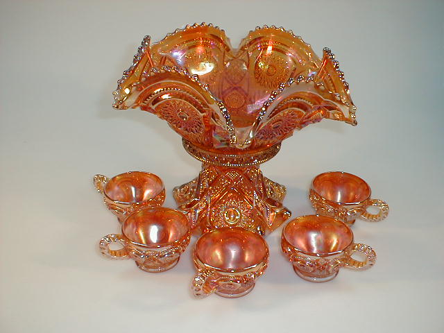 Appraisal: A carnival glass pedestal bowl and five punch cups