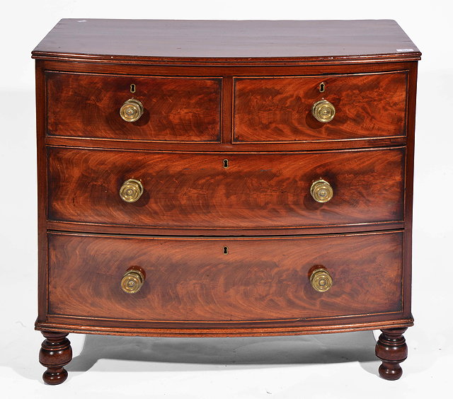 Appraisal: A SMALL BOW FRONTED MAHOGANY CHEST of two short and