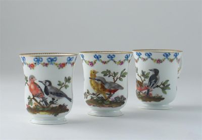 Appraisal: Three Meissen chocolate cups painted with birds and insects with