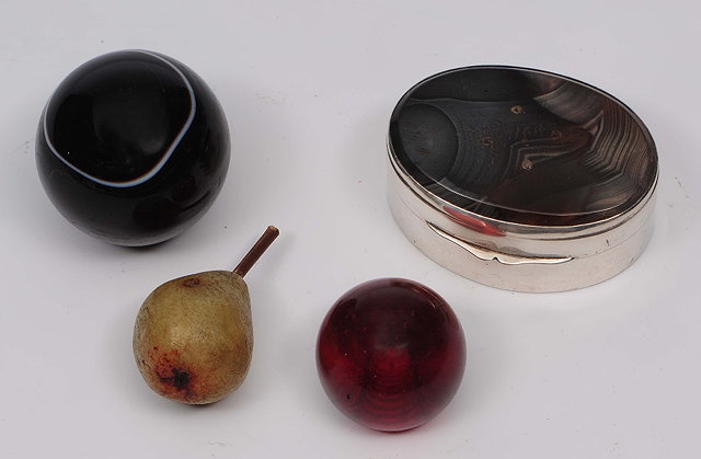 Appraisal: A small silver boxof plain oval form with agate inset