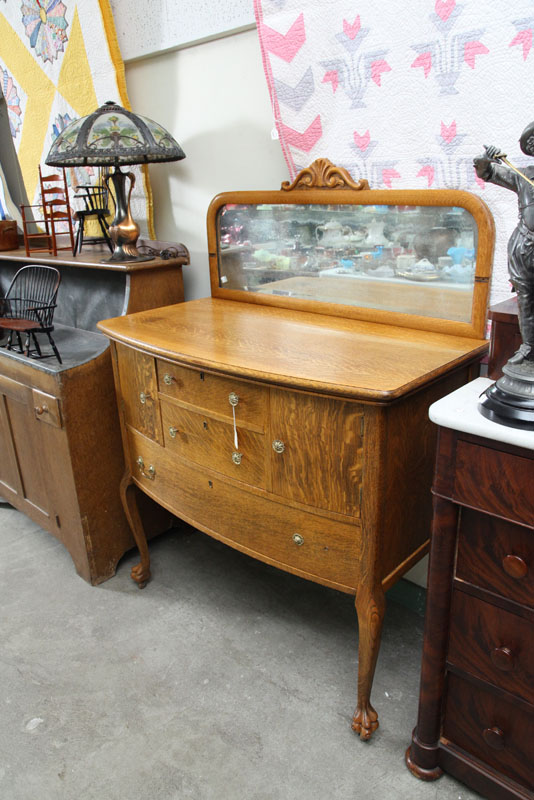 Appraisal: SERVER Oak having a carved and mirrored back and bowed