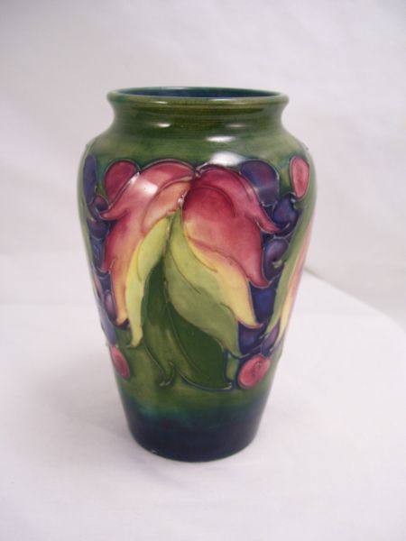 Appraisal: Moorcroft Pottery Vase Leaves and berries design Measures high