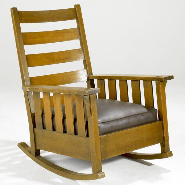 Appraisal: GUSTAV STICKLEY Oversized arm rocker with drop-in leather seats and