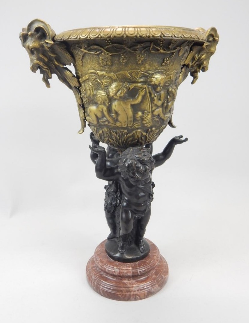 Appraisal: A modern bronze and brass vessel the bowl decorated with