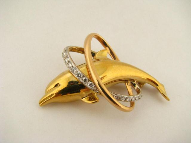 Appraisal: K yellow gold dolphin pin accented with seventeen round cut