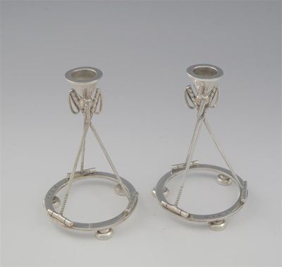 Appraisal: Polo interest a pair of modern candlesticks each formed as