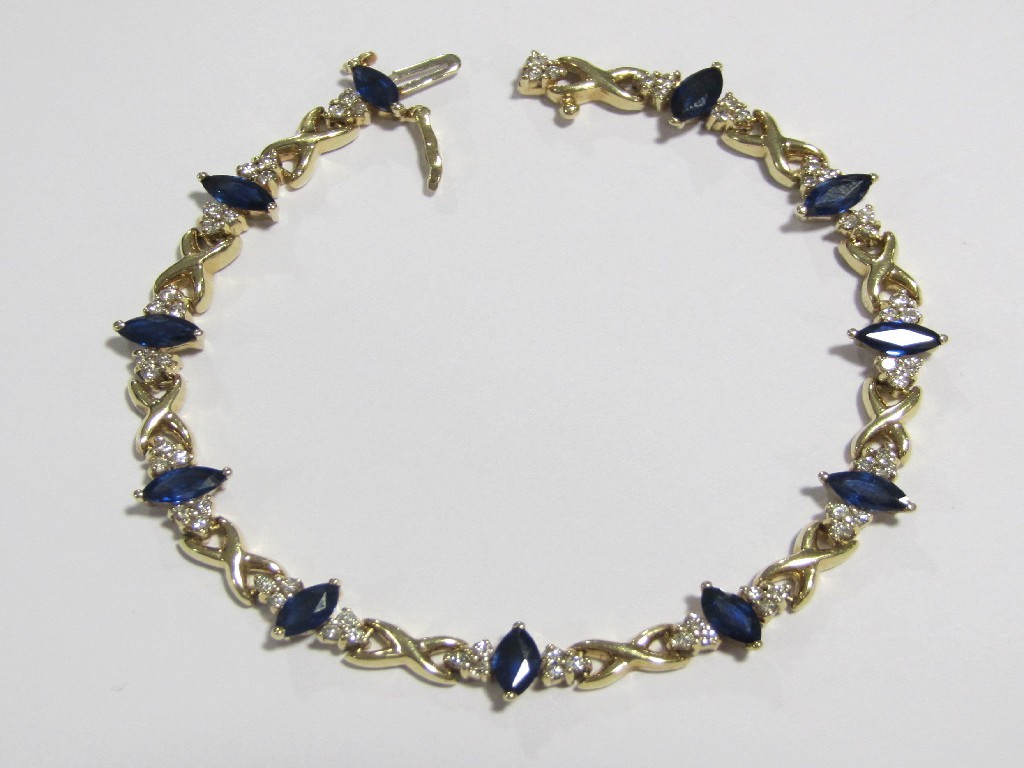 Appraisal: A gold sapphire and diamond set bracelet with eleven stone