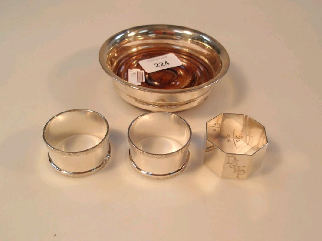 Appraisal: A modern silver wine coaster with a plain everted rim