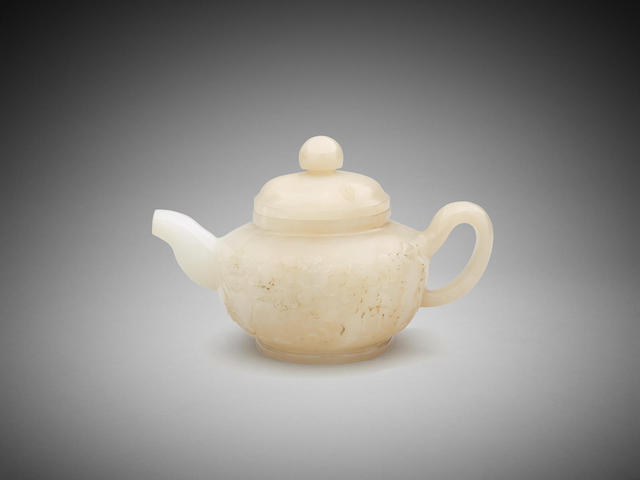 Appraisal: A Chinese carved jade teapot th century Qianlong incised four-character