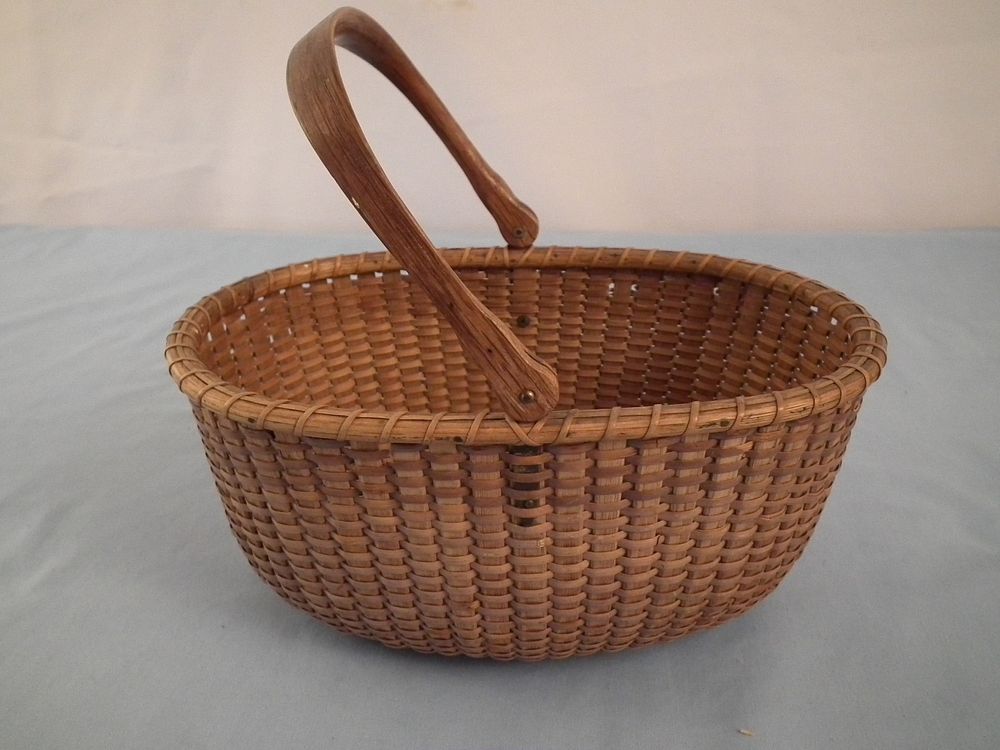 Appraisal: APPLETON NANTUCKET BASKET Antique Nantucket oval woven handleless basket attributed