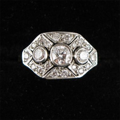 Appraisal: A diamond cluster ring Millegrain set in white gold with