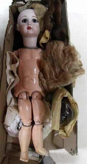 Appraisal: A Bisque headed doll with composite joints body impressed A