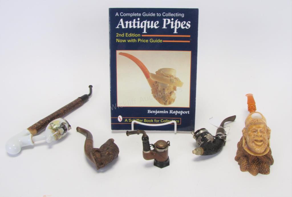 Appraisal: Group of Carved and Porcelain Pipes five total including wood