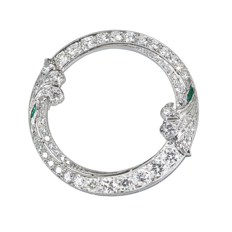 Appraisal: ART DECO DIAMOND PLATINUM CIRCLE BROOCH Condition Report One emerald