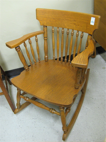 Appraisal: TWO ANTIQUE AMERICAN OAK CHAIRS low spandle-back rocking armchair and