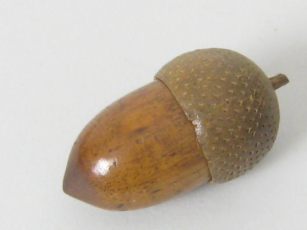 Appraisal: A treen Thimble Holder formed as an acorn