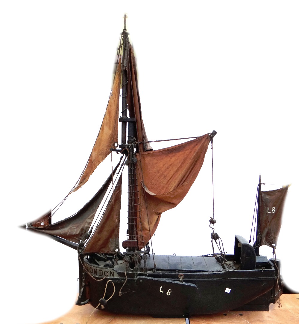 Appraisal: An early th century wooden model of a Thames barge