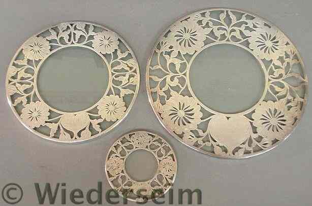 Appraisal: Three round silver overlay glass trivets c dia