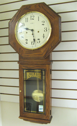 Appraisal: AN OAK SCHOOL HOUSE REGULATOR WALL CLOCK Howard Miller Clock