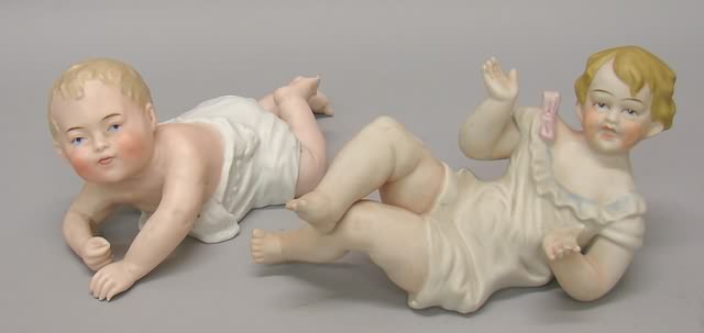 Appraisal: Pair of unmarked bisque piano babies German reclining baby in