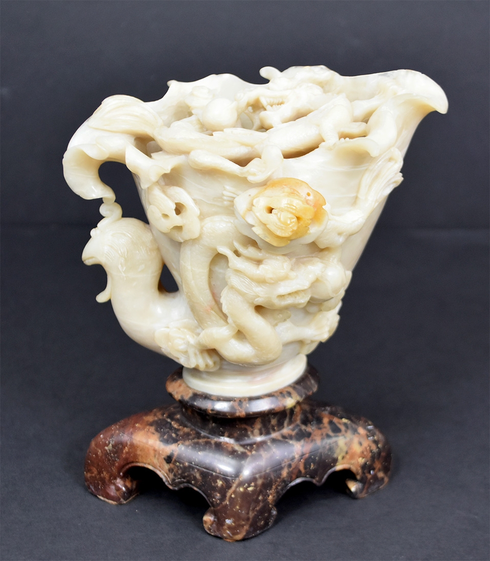 Appraisal: CHINESE SOAPSTONE CUP FORM DRAGON STUDYThe grayish pale green stone