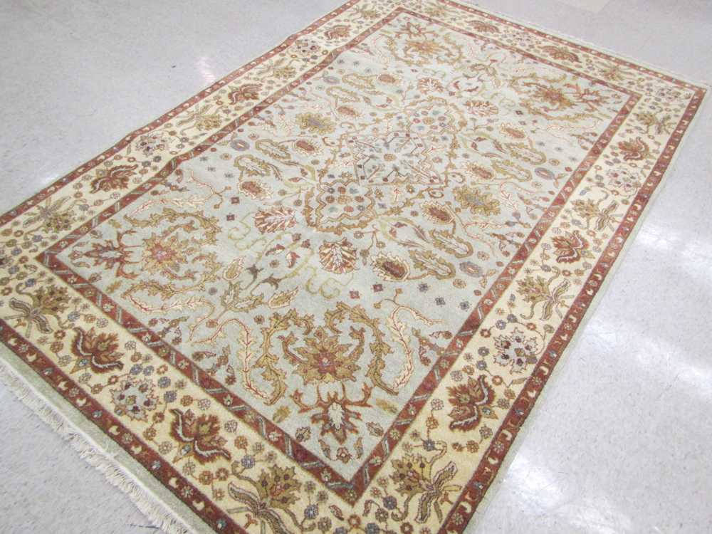 Appraisal: NEW HAND KNOTTED ORIENTAL CARPET Indo-Persian scrolling floral raceme design