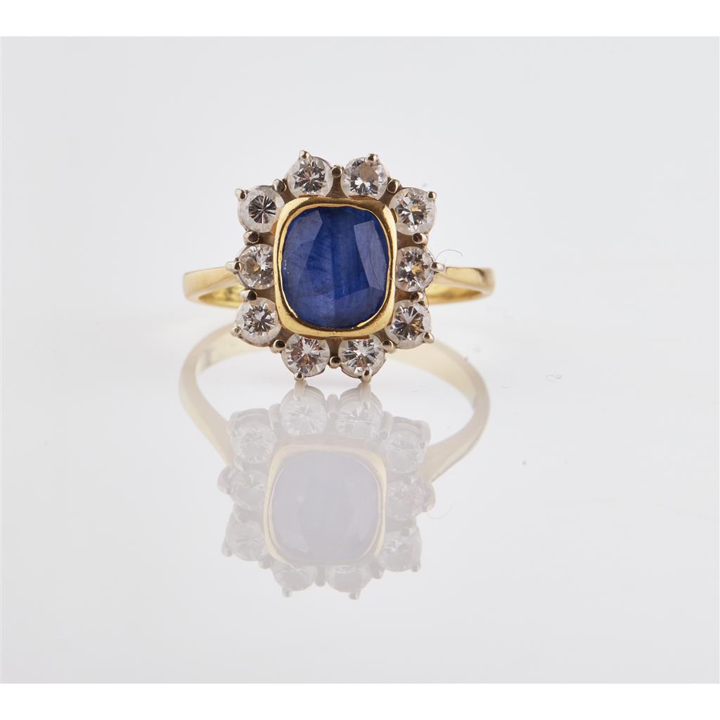 Appraisal: A sapphire and diamond set cluster ring collet set with