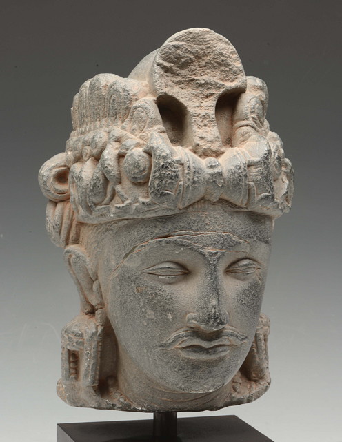 Appraisal: AN ANTIQUE INDIAN CARVED STONE HEAD OF A MALE FIGURE