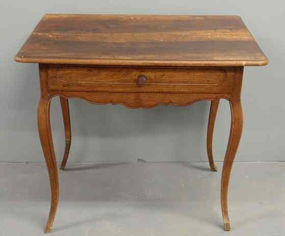 Appraisal: French fruitwood tea table th c with a rectangular top