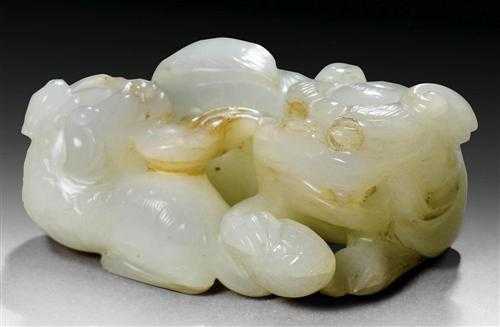 Appraisal: LIONESS WITH CUB China th century L cm White jade