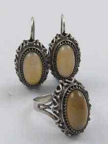 Appraisal: A pair of Russian silver earrings with matching ring set