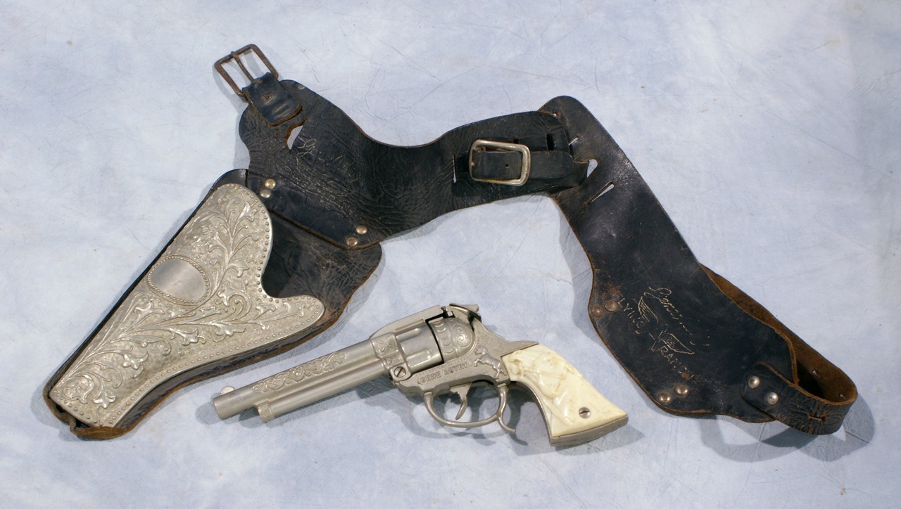 Appraisal: Gene Autry metal cap gun with leather metal holster with