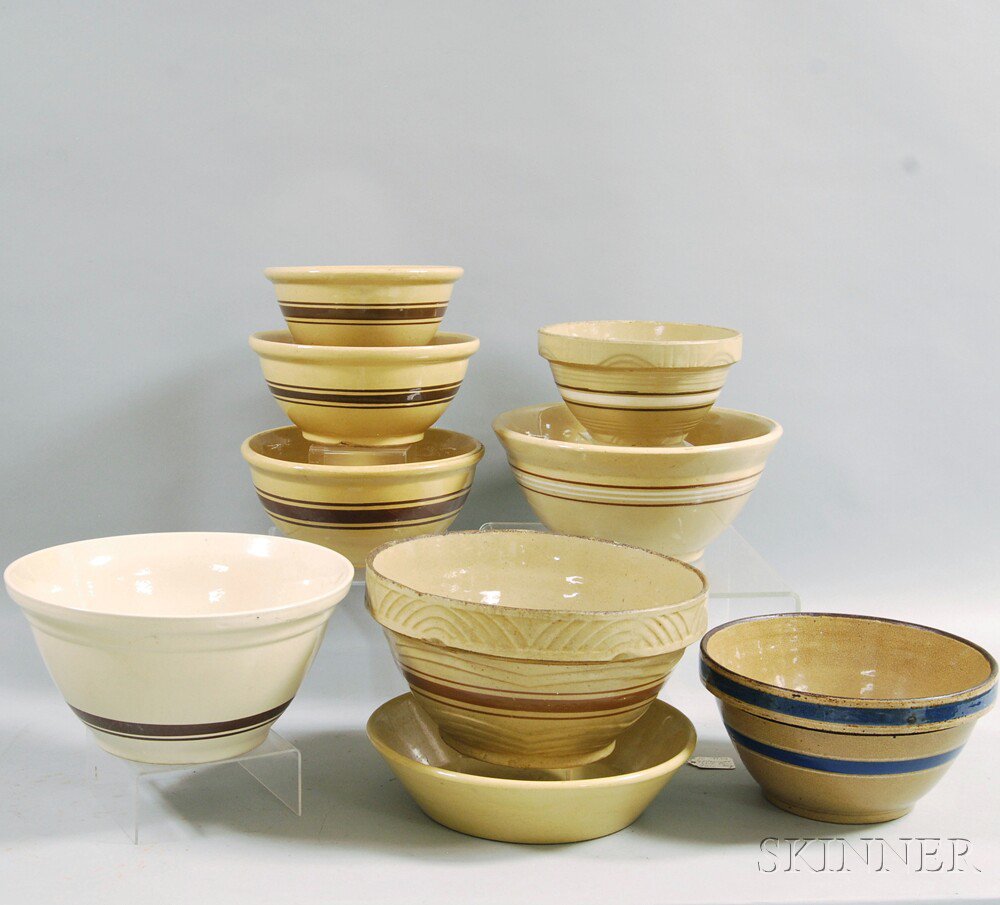 Appraisal: Nine Banded Yellowware Mixing Bowls with mocha blue and white