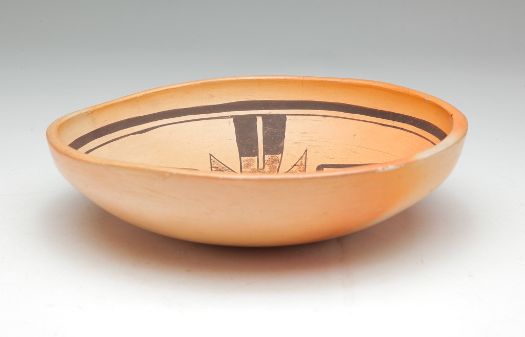 Appraisal: Twentieth century Shallow bowl with slip decorated interior with geometric