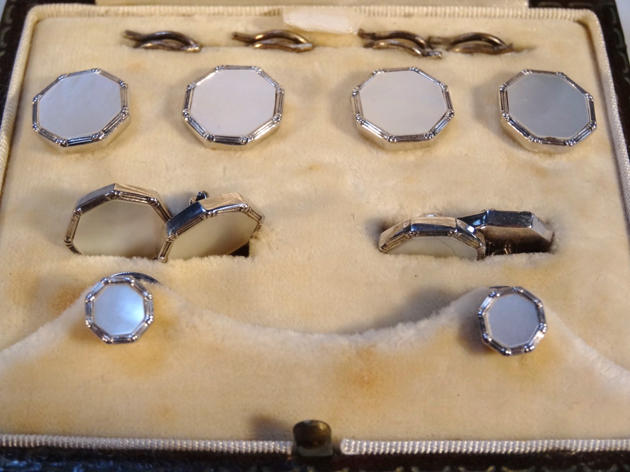 Appraisal: A cased set of mother of pearl finish cufflinks each