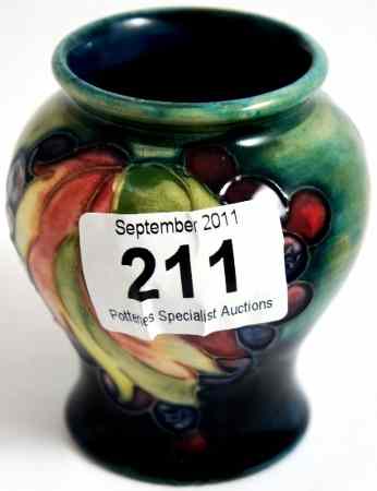 Appraisal: Moorcroft Small Vase decorated with Leaf and Berry on a