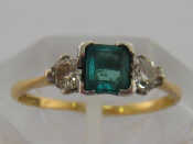 Appraisal: An carat yellow gold emerald and diamond ring the central