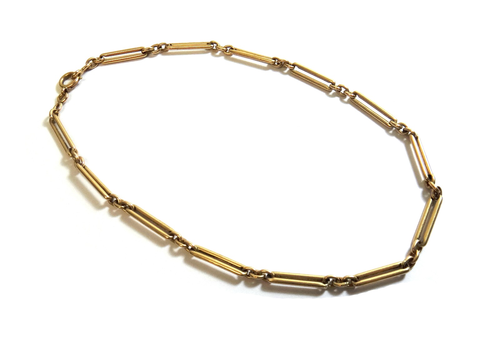 Appraisal: A gold oval and bar link neckchain fitted with a