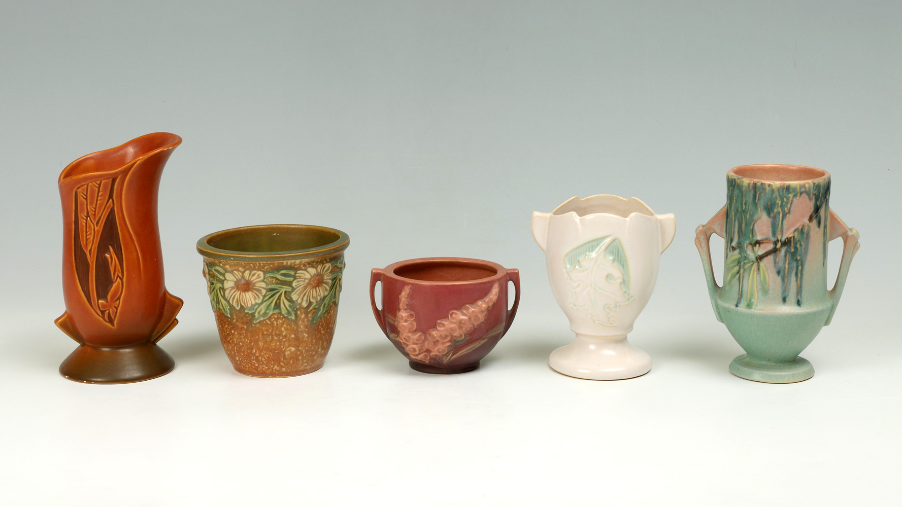 Appraisal: PIECE ROSEVILLE POTTERY COLLECTION Comprising - Planter in the Dahlrose