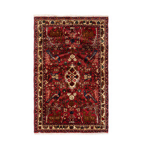 Appraisal: A Persian Wool Rug th Century feet inches x feet