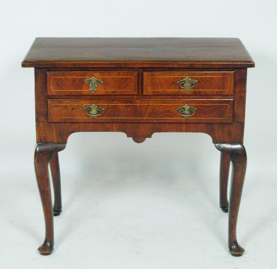 Appraisal: A WALNUT LOWBOY th century and later the moulded edged