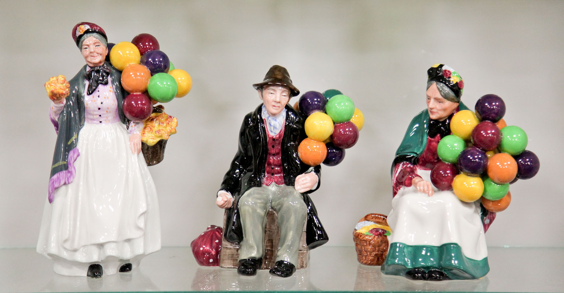 Appraisal: THREE ROYAL DOULTON FIGURINES England mid th century ''The Baloon