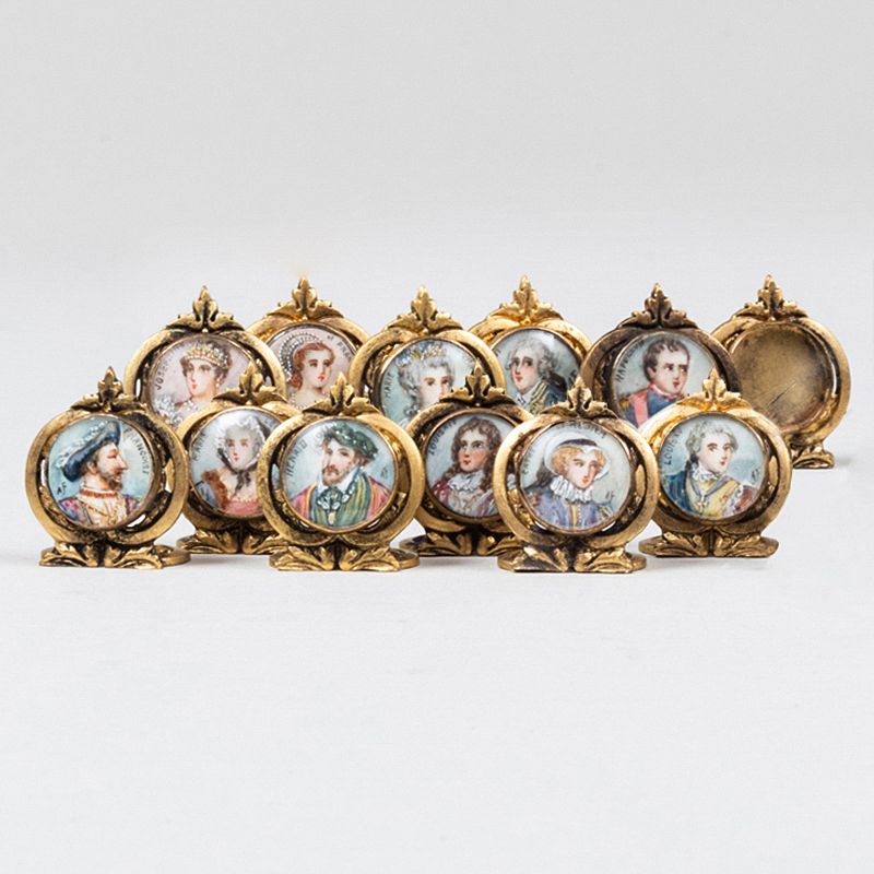 Appraisal: Set of Twelve Gilt-Metal Place Card Holders Decorated with Royal