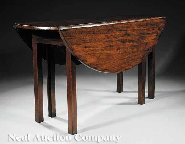 Appraisal: A Georgian Mahogany Wake Table with demilune drop leaves plain