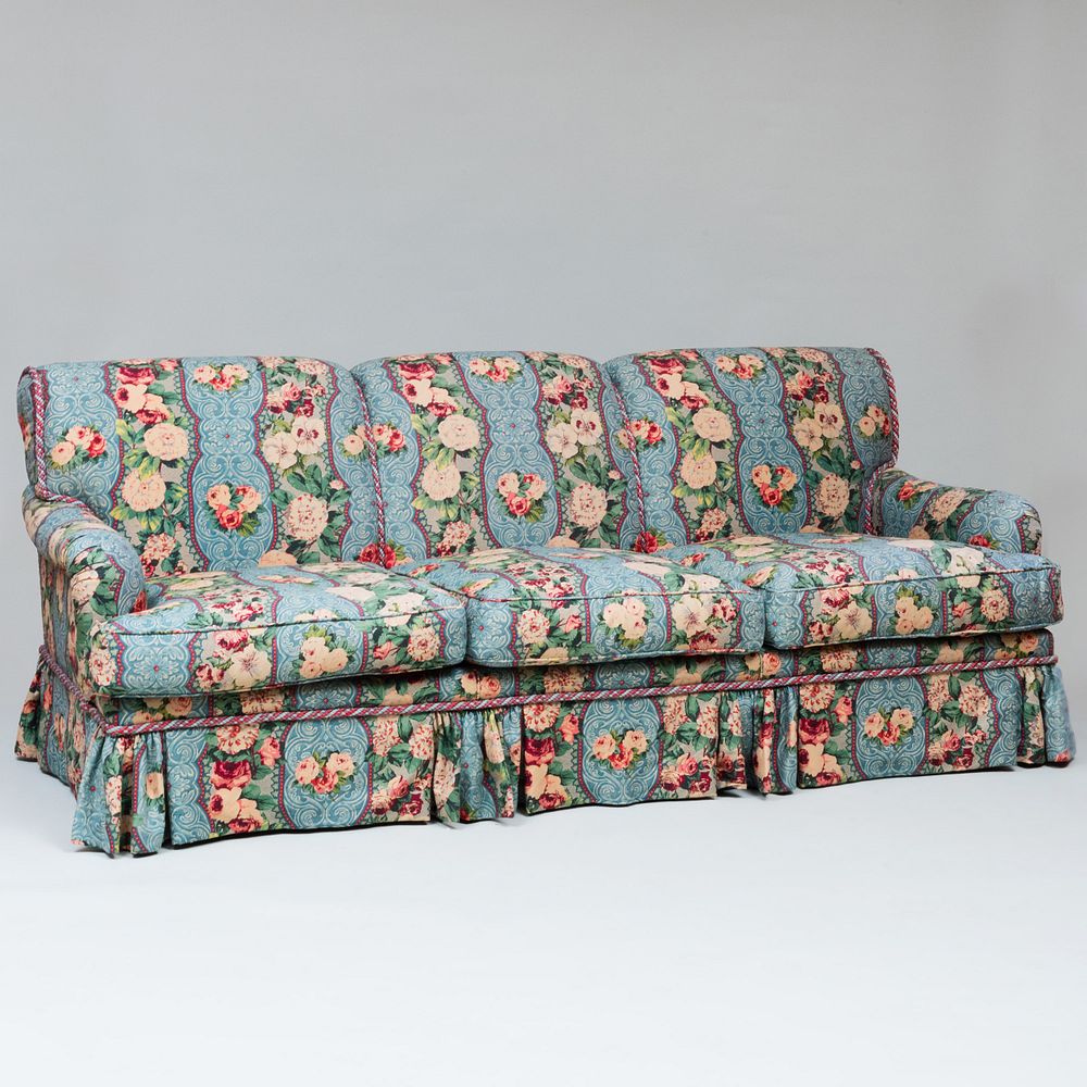 Appraisal: Linen Chintz Upholstered Three Seat Skirted Sofa With two red