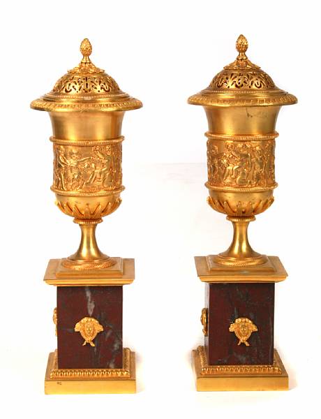 Appraisal: A Empire style metamorphic gilt bronze mounted covered urns height