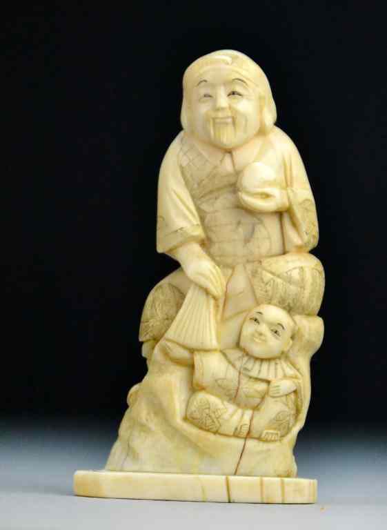 Appraisal: Japanese Carved Ivory OkimonoFinely carved to depict a man holding